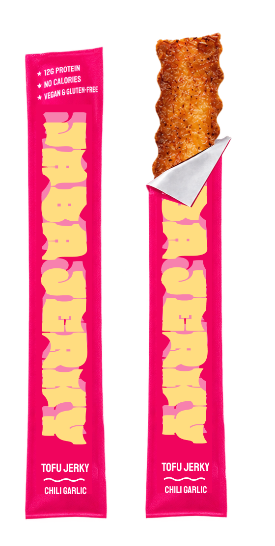 Two pink Jaba Jerky Chili Garlic packs, one torn open with a piece of tofu jerky sticking out